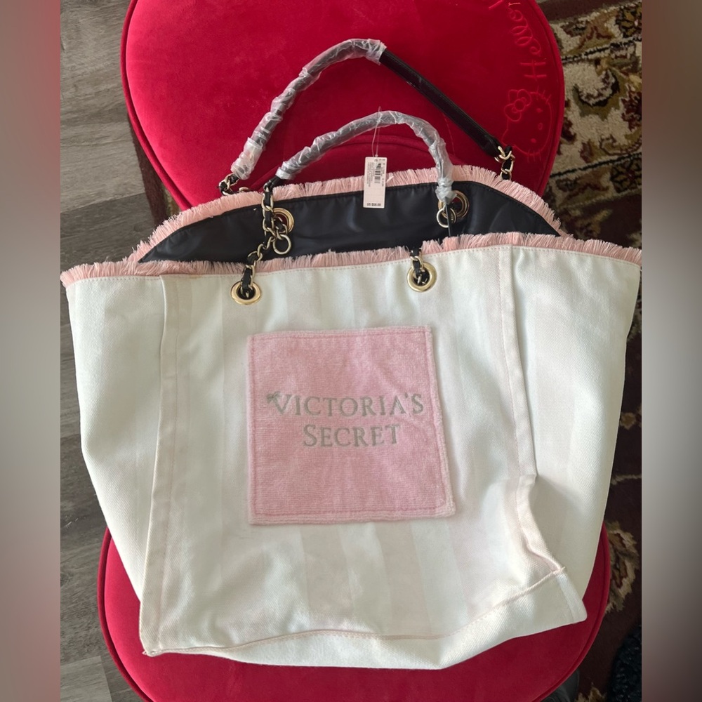 Victoria's Secret pink and white tote.